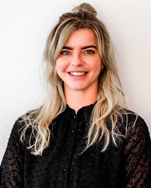 business woman blondine wearing a black blouse